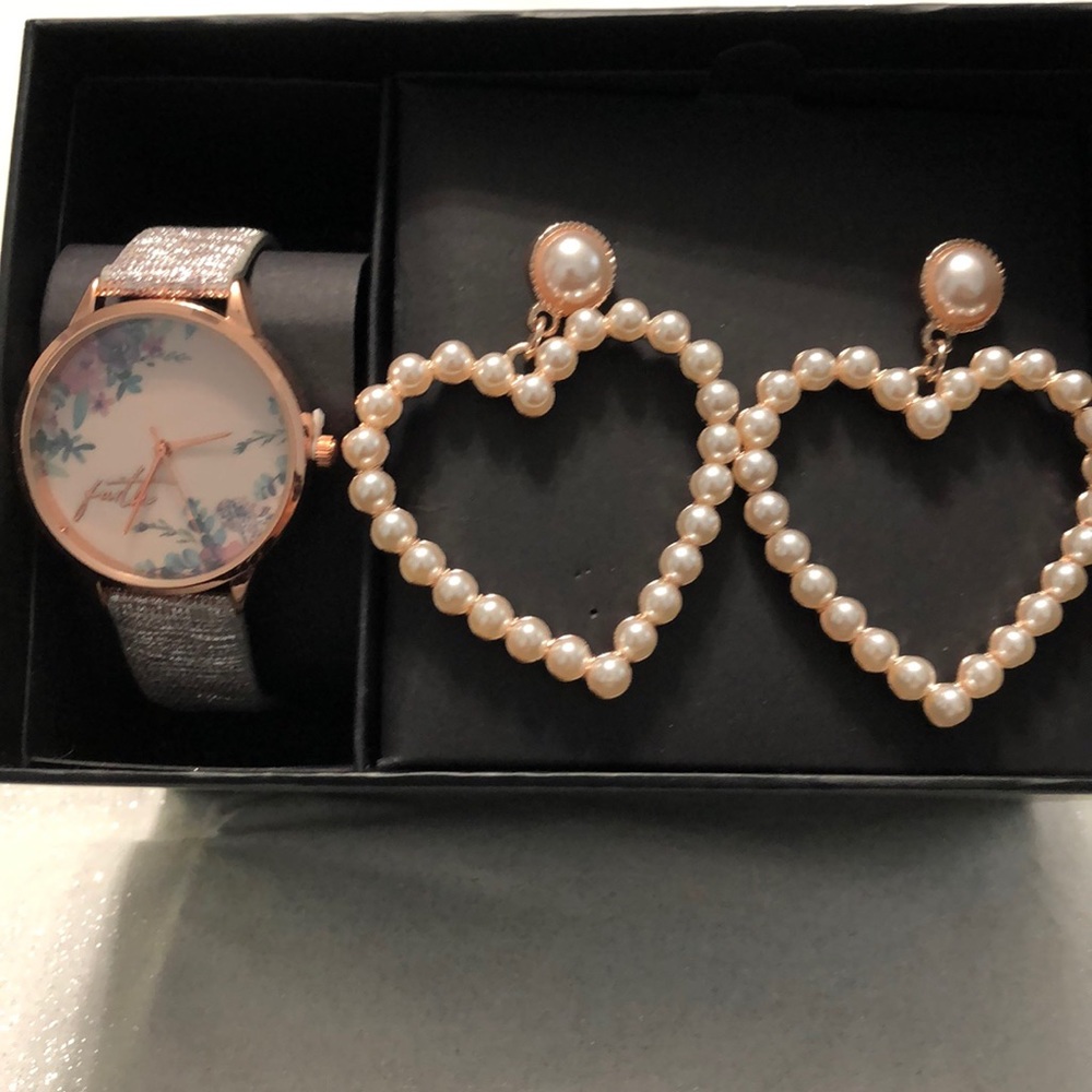 Watch and earrings never been opened